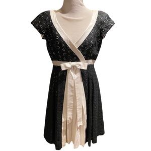 Moschino Couture Black Eyelet dress with white trim bow at waist. SZ 10 US